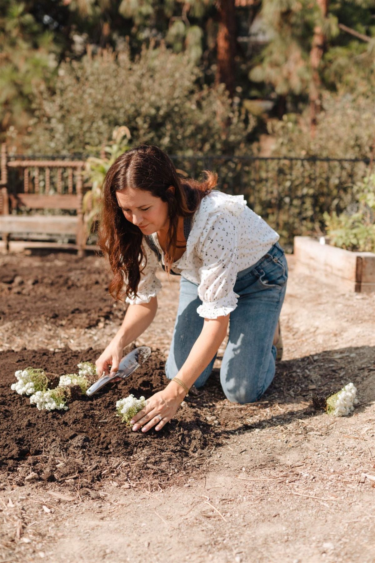 woman gardening in overalls