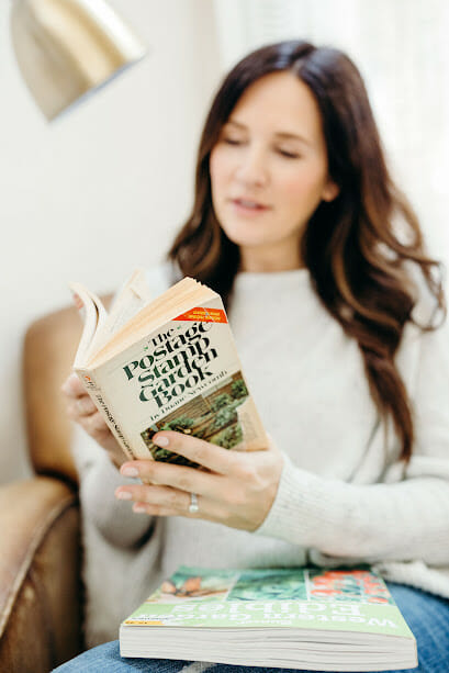 woman reading a gardening book