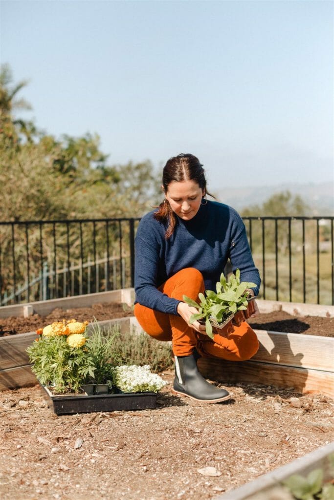 Woman gardening in sweater 