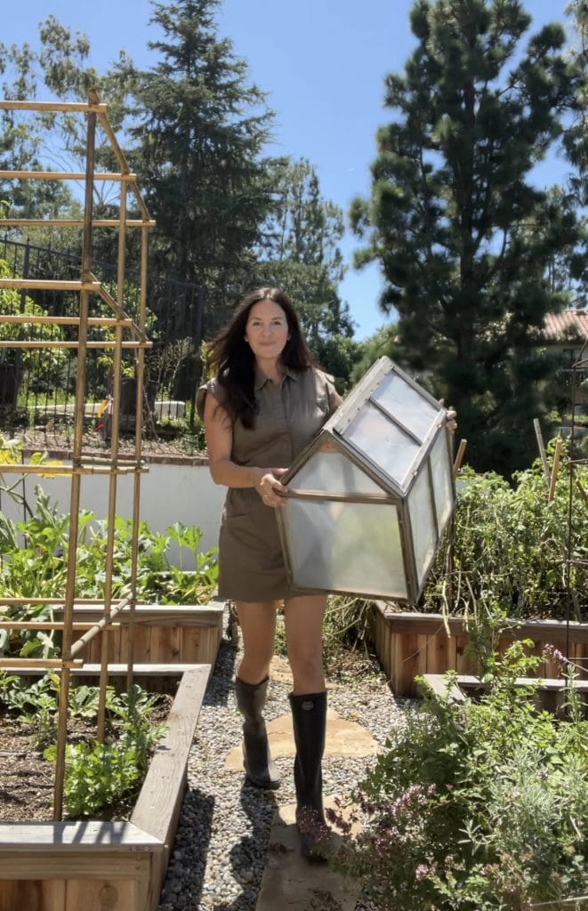 Bailey Van Tassel holding her mini greenhouse